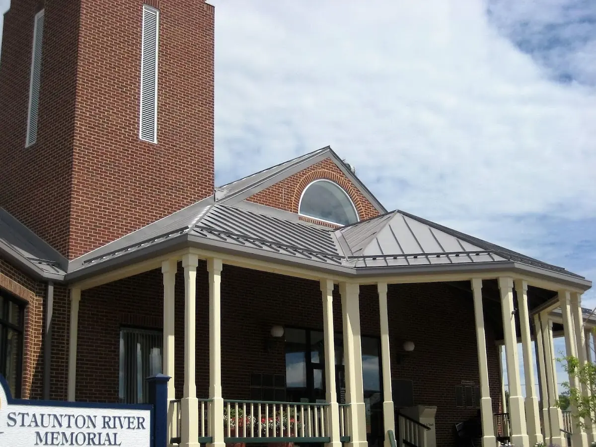 Skilled roofing craftsmen working on a residential roof in Farmersville